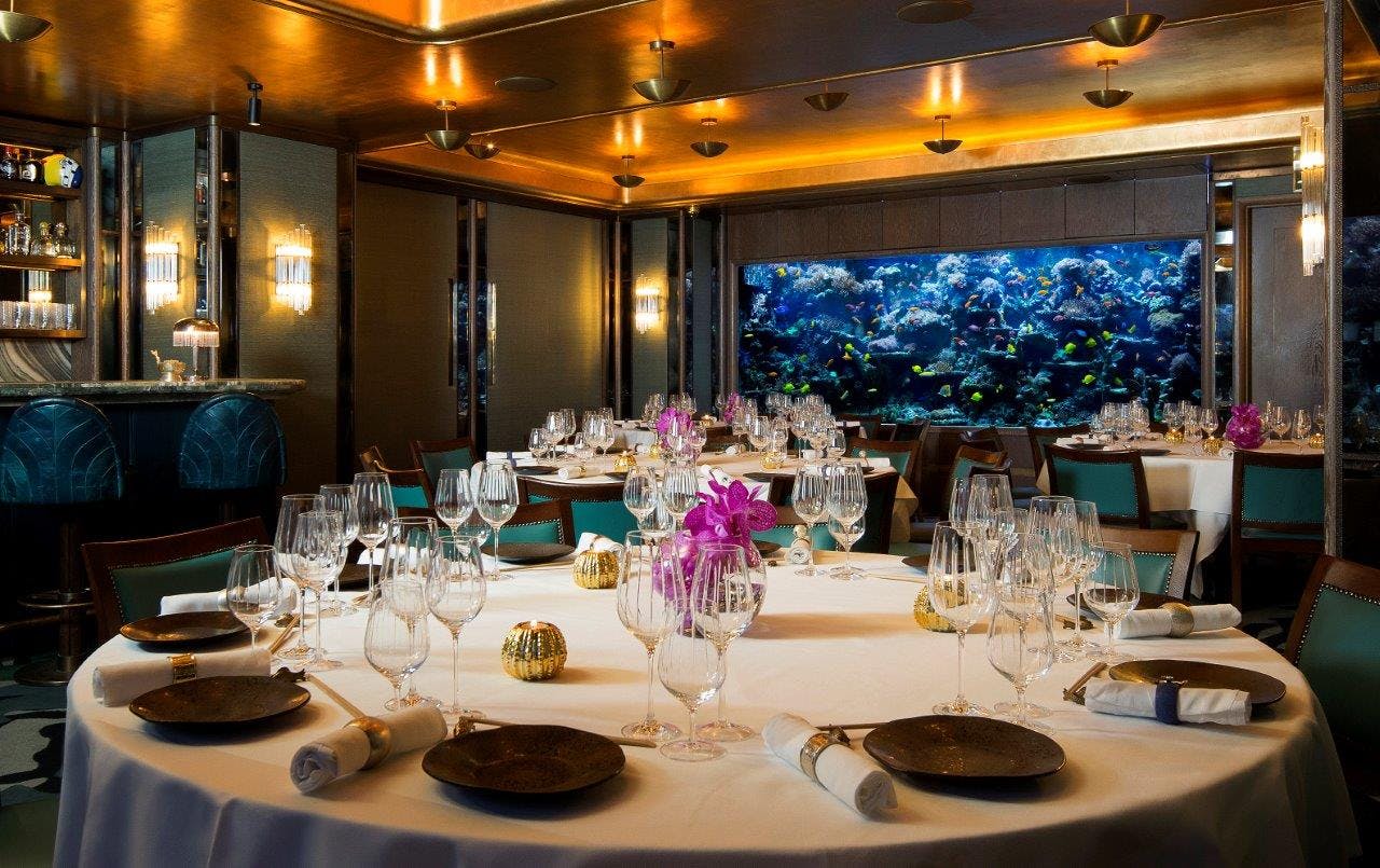 Elegant dining in The Coral Reef Room at Sexy Fish, perfect for upscale events.