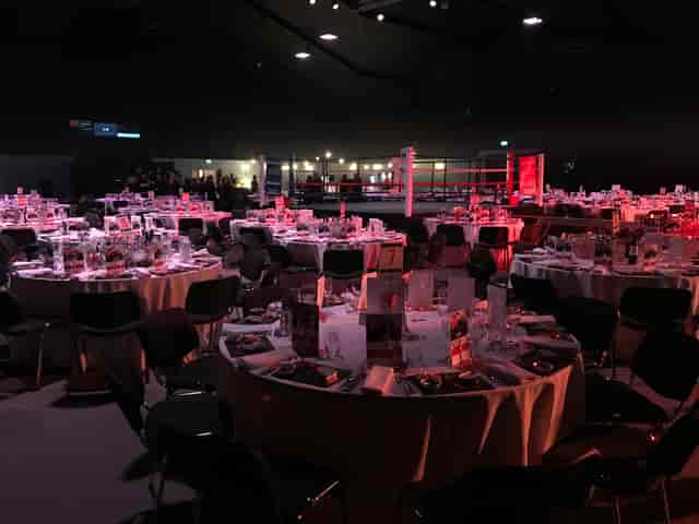 Elegant auditorium with round tables, perfect for conferences and events.