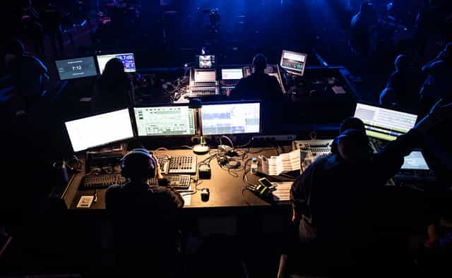 Dynamic control room for live events with screens and equipment at !Audacious Conferencing.