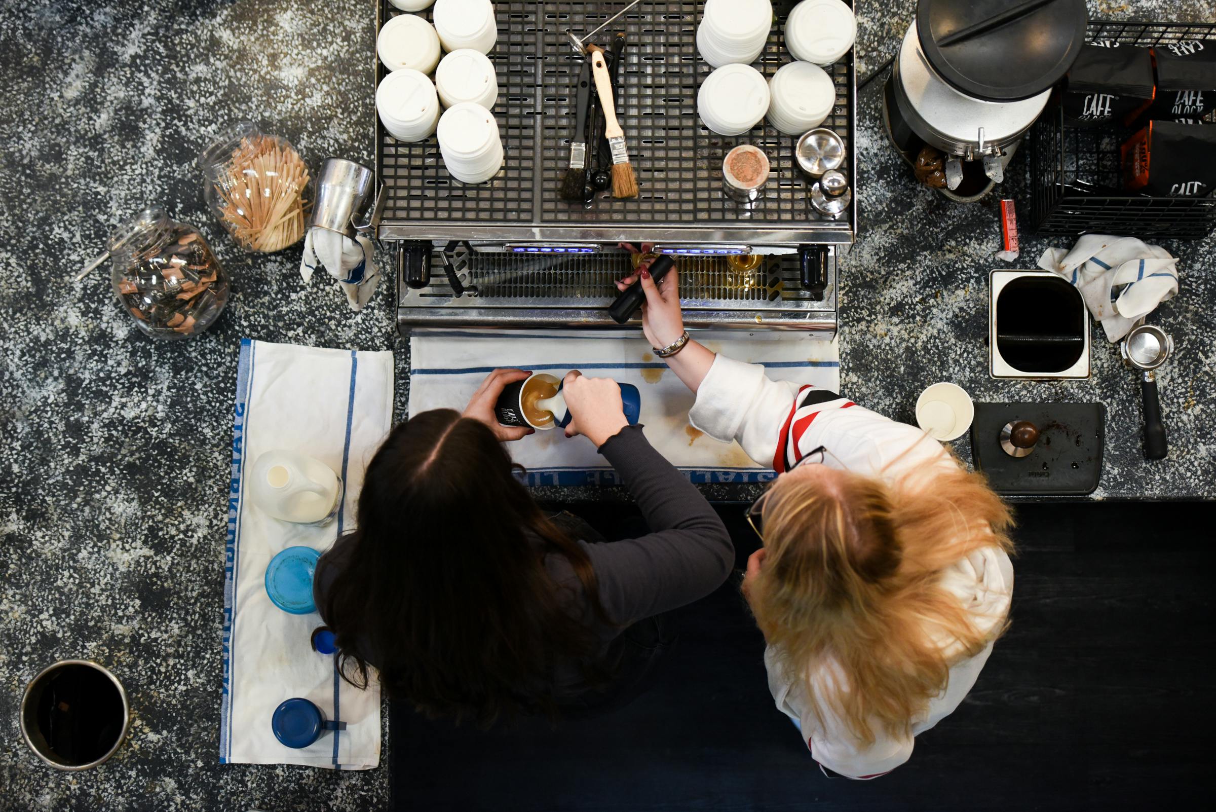 Auditorium coffee station with baristas, perfect for event networking and energizing breaks.