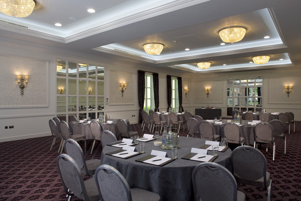 Brunel Suite meeting room at Bailbrook House Hotel with elegant chandeliers, ideal for conferences.