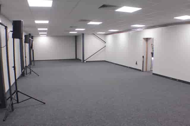 Versatile event space with sound equipment for meetings and presentations at !Audacious Conferencing.