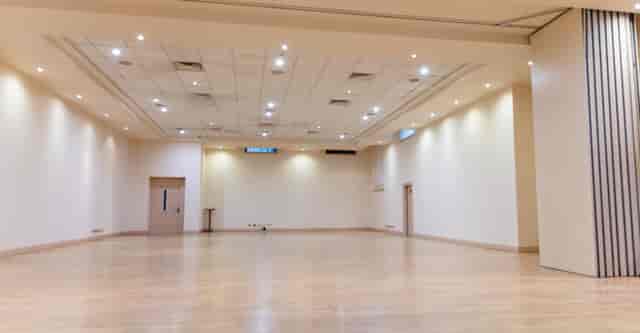 Spacious Tavistock venue with neutral decor for conferences and workshops.