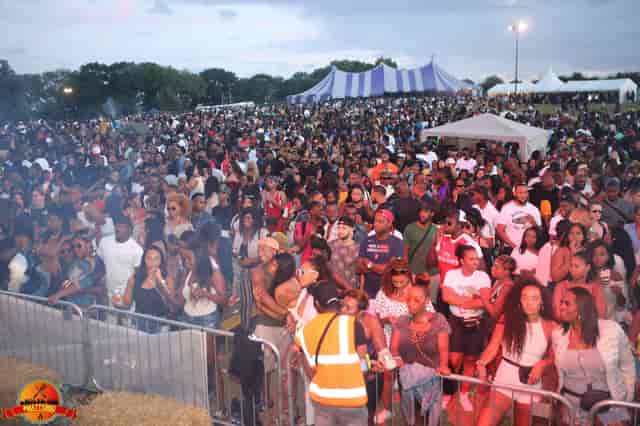 Vibrant outdoor event at Main Events Field, Colesdale Farm with large crowd and tents.