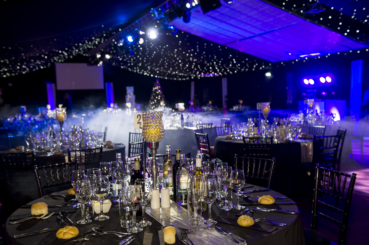 Elegant event space with fine table settings, ideal for galas and formal gatherings. - Banner