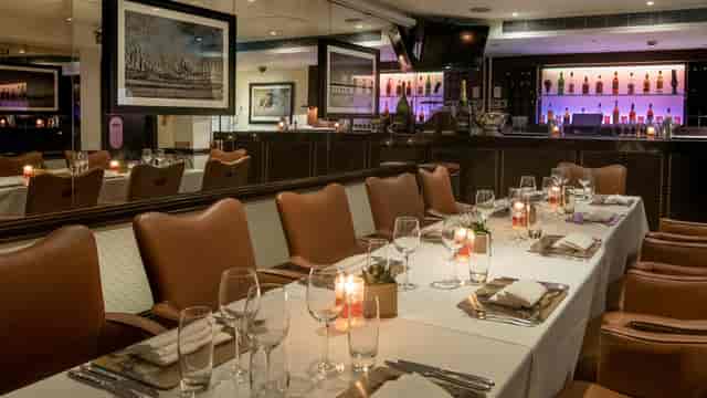 Elegant dining setup at 43 Below for corporate dinners and networking events.