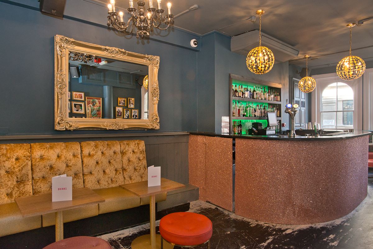 Cocktail Lounge in The Village, stylish venue with plush seating for networking events. - Banner