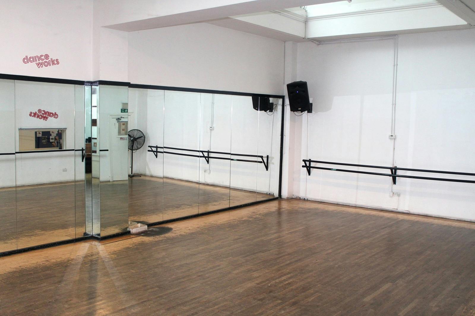 Spacious Danceworks Studio 1 with hardwood floors, ideal for wellness workshops and fitness classes.