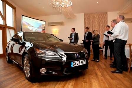 Sleek black car at Mythe Barn for innovative automotive product launch event.