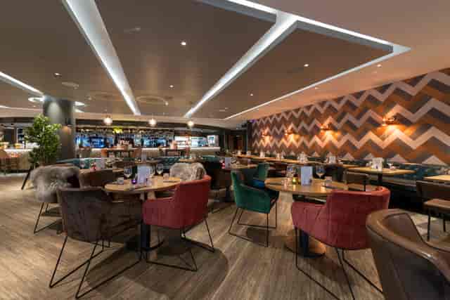 Modern restaurant venue with stylish decor, ideal for events and meetings.