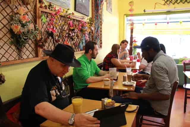 Vibrant café venue with colorful decor, ideal for networking and casual meetings.