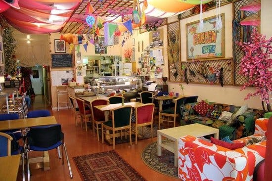 Vibrant café venue with colorful decor for creative meetings and casual events.