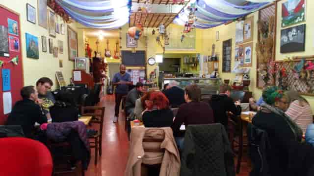 Cozy Garden Community Cafe venue with colorful decor for informal meetings and events.