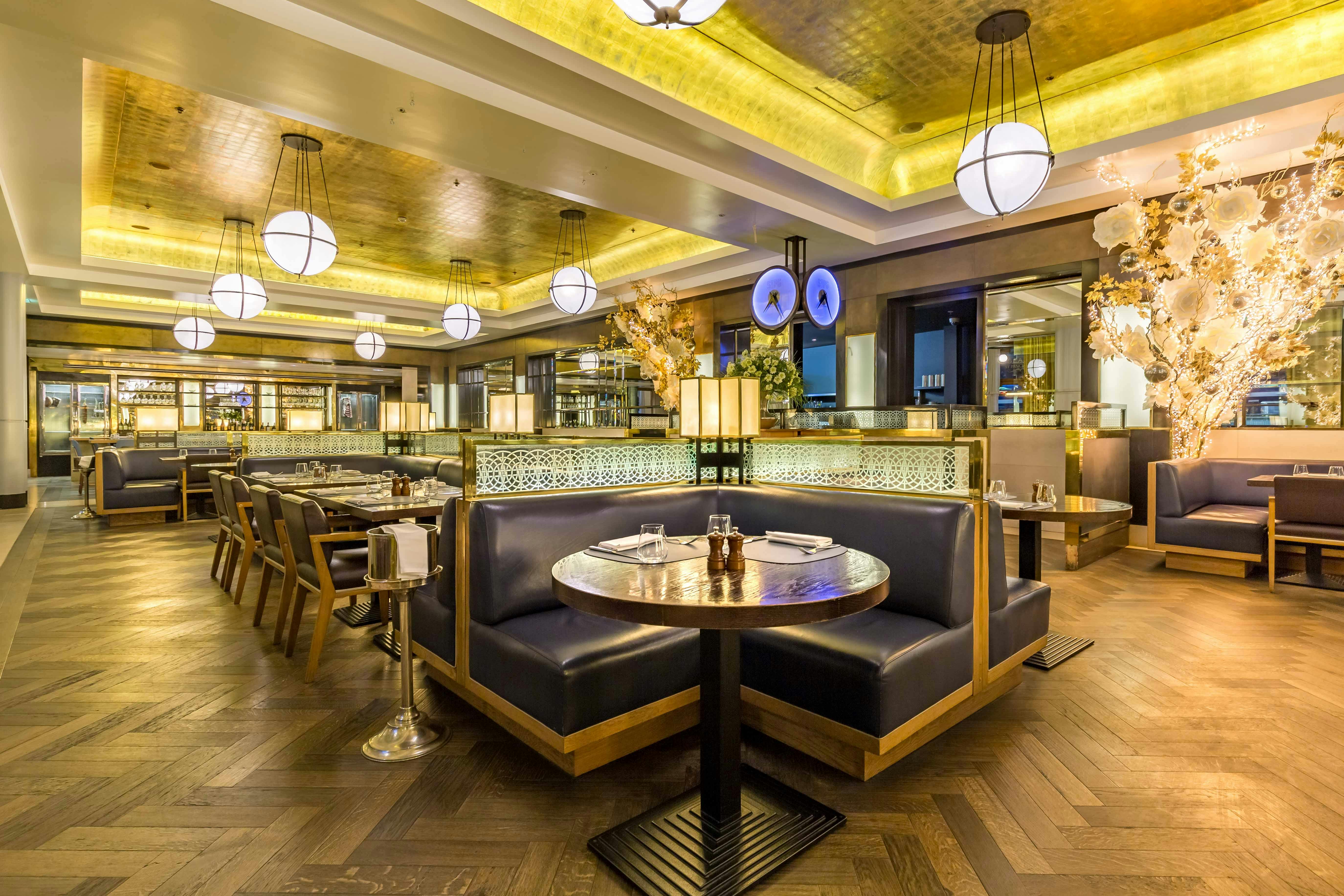 Stylish St Pancras Brasserie interior with elegant booths for corporate events and gatherings.