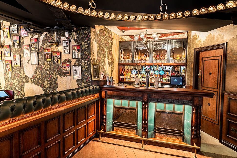 Stylish bar with vintage decor at Flight Club Bloomsbury for networking events.