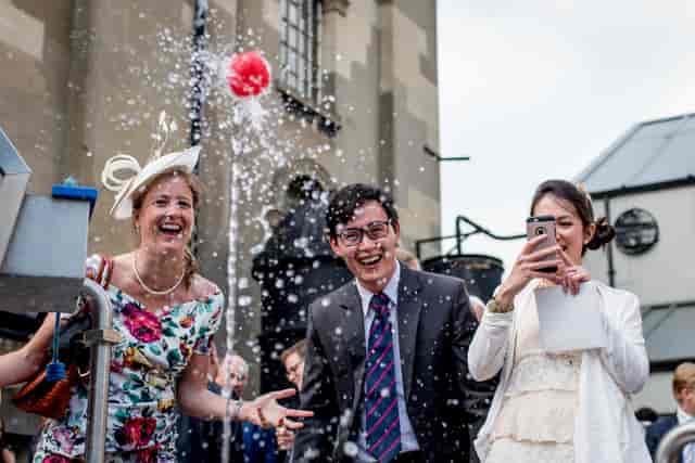 Outdoor event at London Museum of Water & Steam with guests splashing water joyfully.