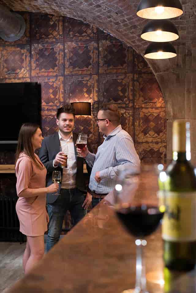 Networking event at Dock Street Bar with elegant decor and warm lighting.