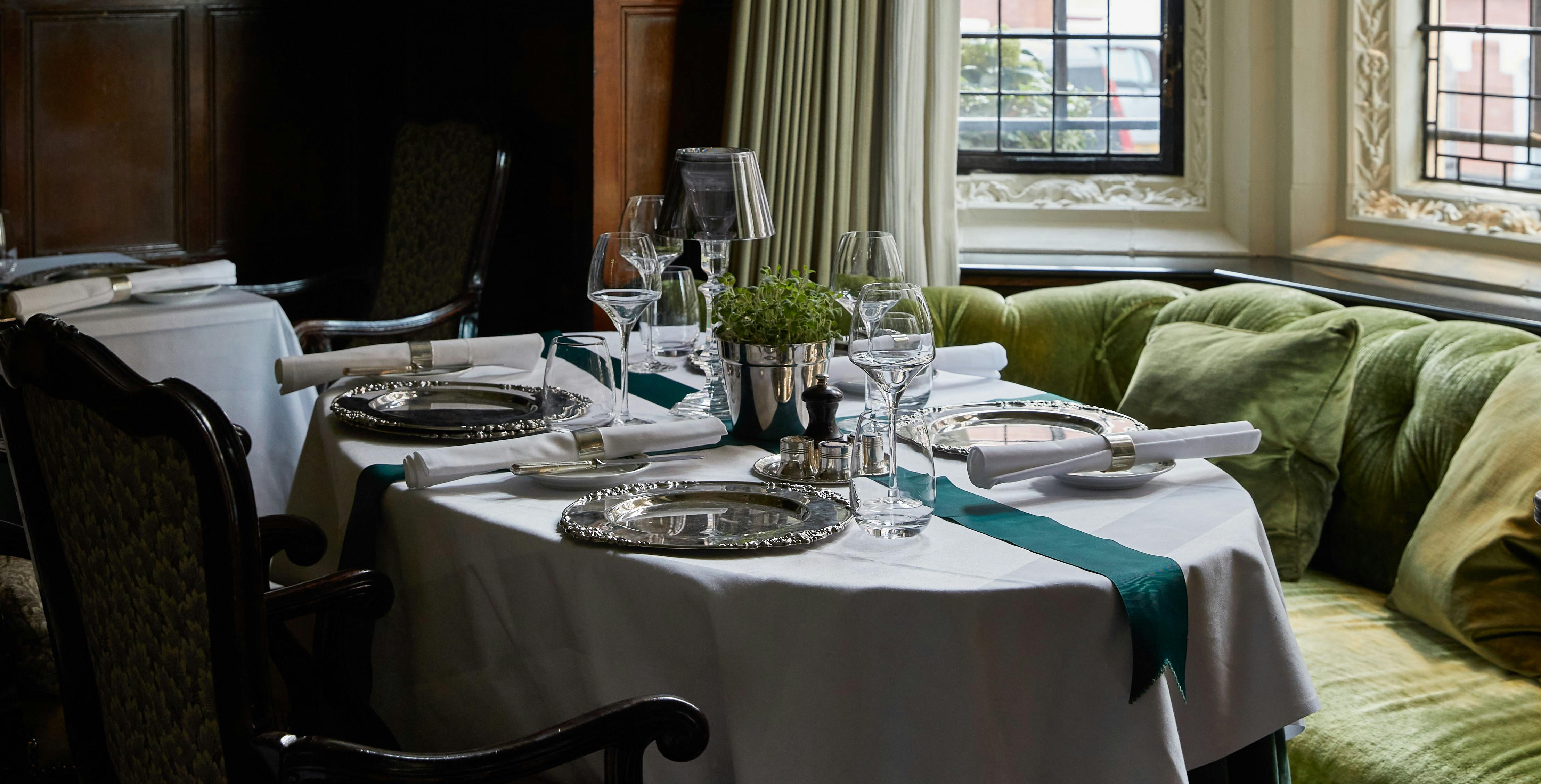 Elegant dining table at Cheneston's Restaurant, perfect for corporate dinners and celebrations.