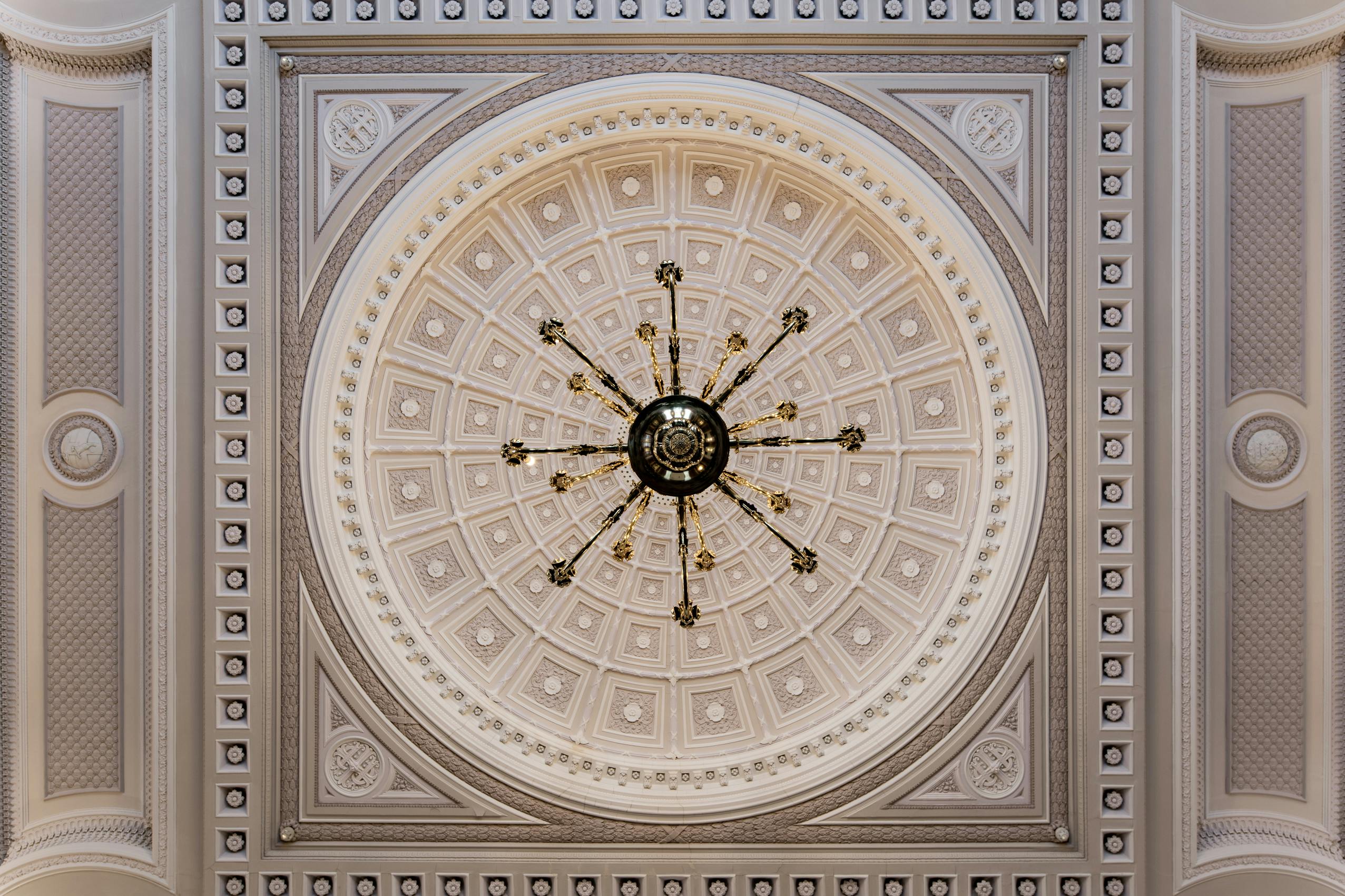 Elegant Ballroom ceiling with chandelier, perfect for upscale events and gatherings.