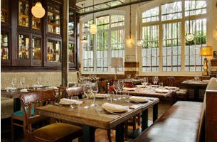 Stylish restaurant area with warm lighting, ideal for intimate gatherings and corporate events.