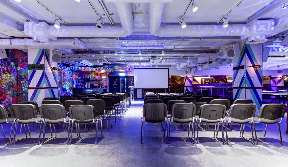 Versatile conference space with vibrant decor for creative meetings in Shoreditch.