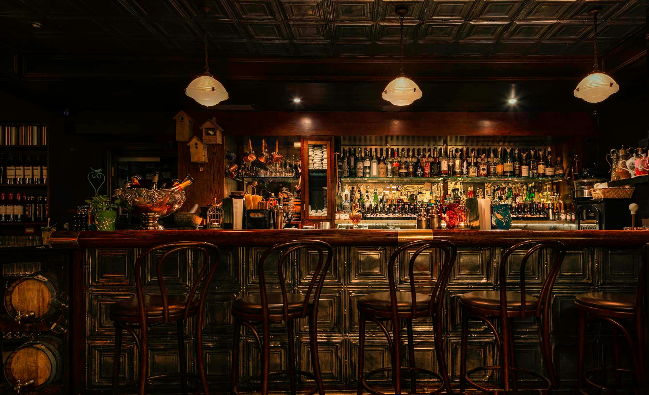 Stylish bar venue with warm lighting, perfect for cocktail receptions and networking events.