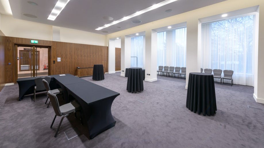 Versatile Haslett Room event space with natural light, ideal for meetings and networking.