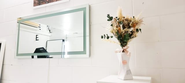 Stylish floral arrangement in modern workshop studio for events and meetings.