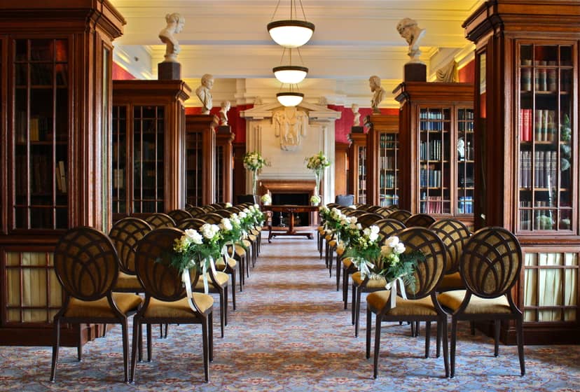 Elegant event space at London Marriott County Hall with floral accents and warm lighting.