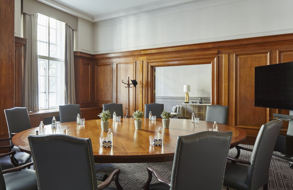 Boardroom at London Marriott County Hall with round table, ideal for meetings and events.