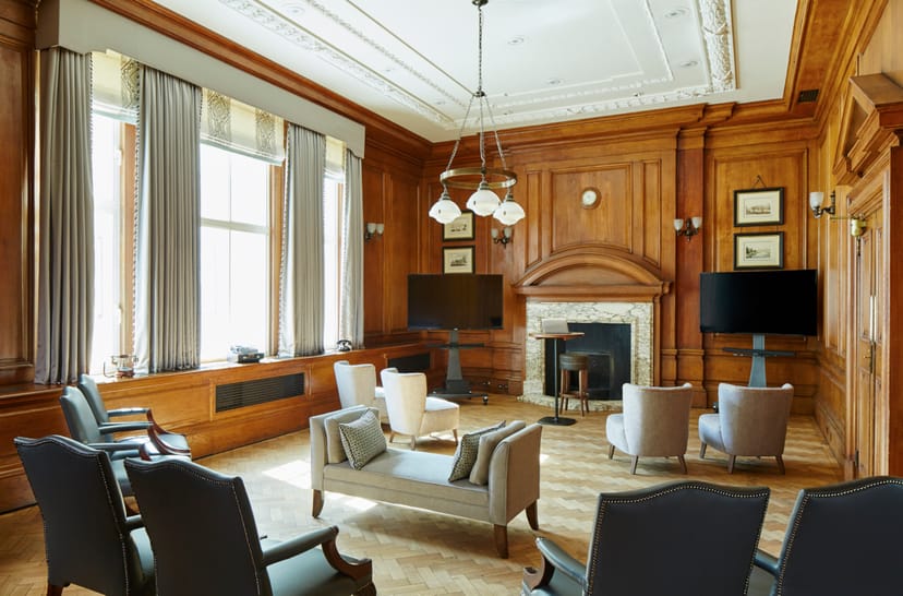Herbert Morrison in a sophisticated meeting room with wood paneling at London Marriott Hotel.