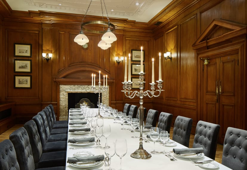 Elegant dining room with fine china for formal events at London Marriott Hotel.