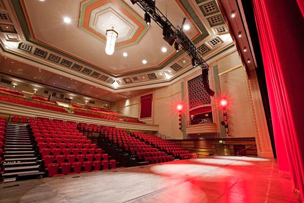 Great Hall Theatre auditorium with elegant decor, ideal for corporate events and performances.