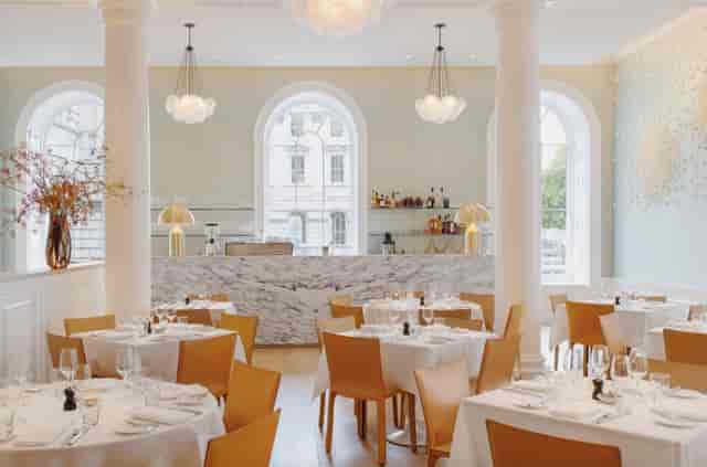Elegant dining venue with marble accents, perfect for upscale events and receptions.