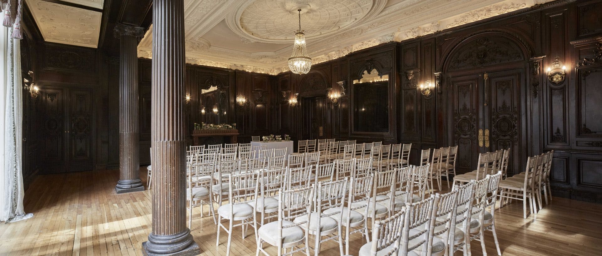 Churchill Room at Dartmouth House: elegant wooden paneling, ideal for upscale events.