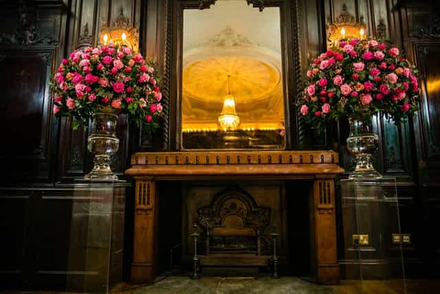 Elegant Churchill Room with floral arrangements, ideal for upscale events and receptions.