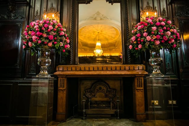 Elegant Churchill Room with floral arrangements, ideal for upscale events and receptions.