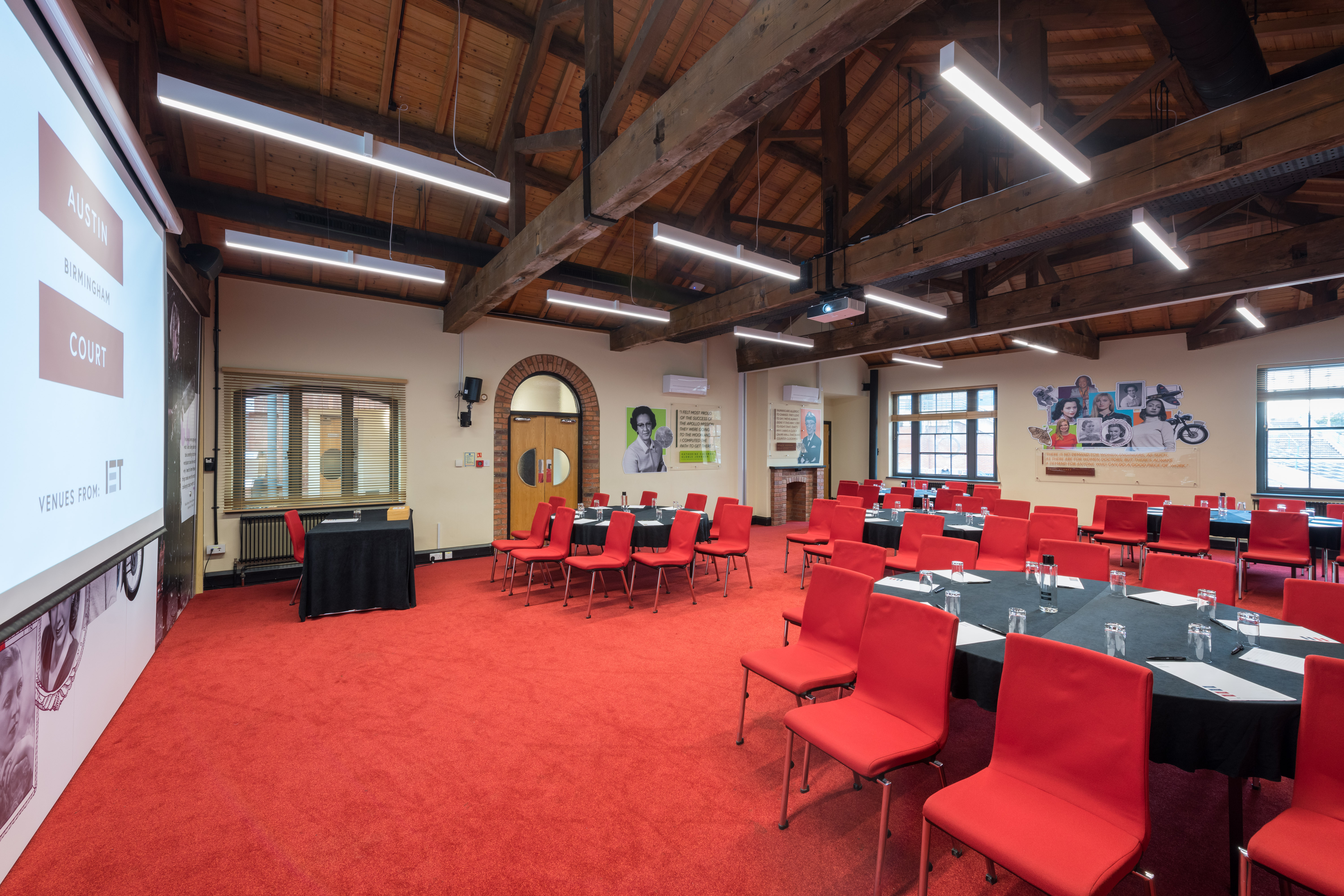 Lodge Room 1 at IET Birmingham: Austin Court, featuring round tables and natural light for events.