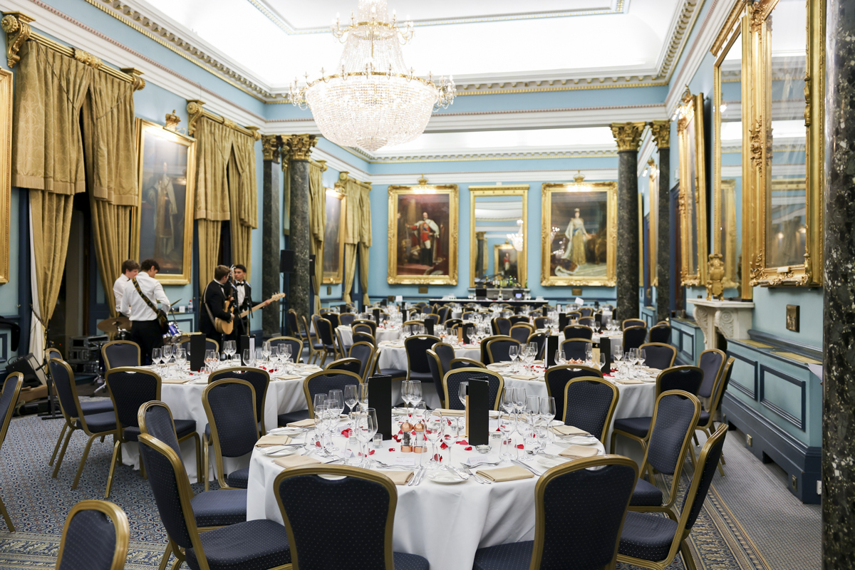 Elegant Nash Room banquet setup with chandelier, perfect for formal events and entertainment. - Banner