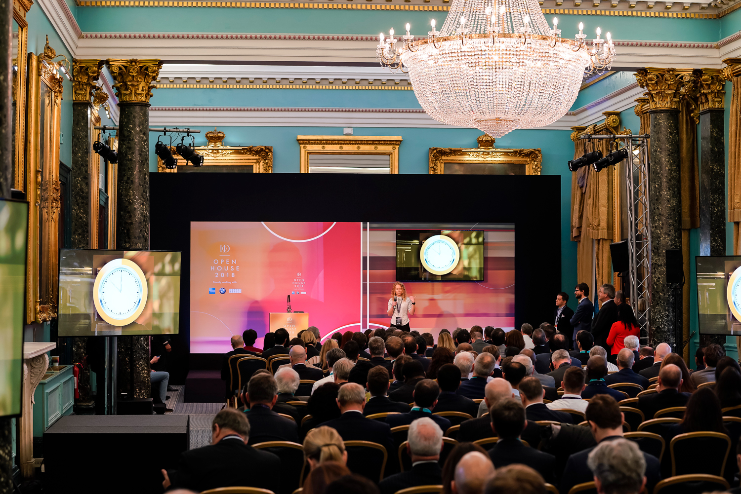 Nash Room conference at 116 Pall Mall with elegant decor and engaged audience. - Banner