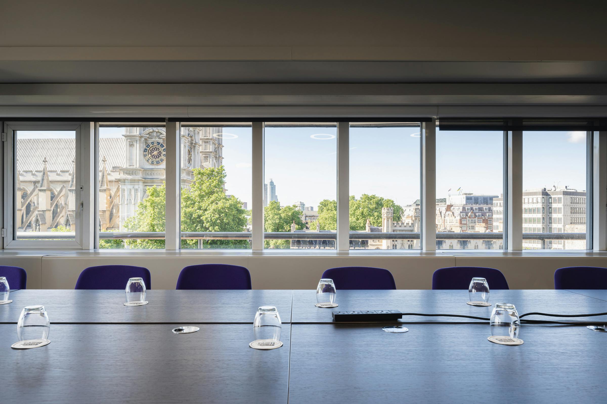 Modern meeting room in QEII Centre with city view, perfect for corporate events.