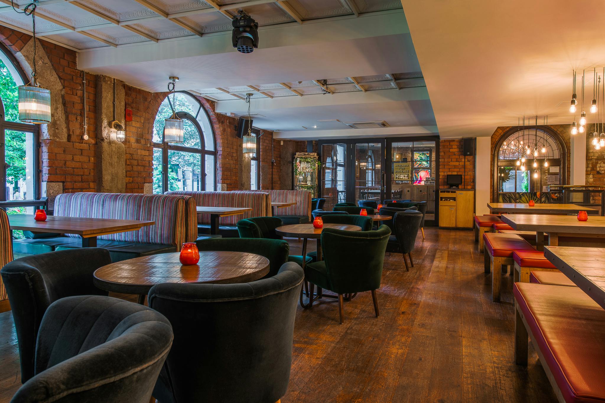 Stylish Garden Bar venue with elegant lighting, perfect for networking events and meetings.