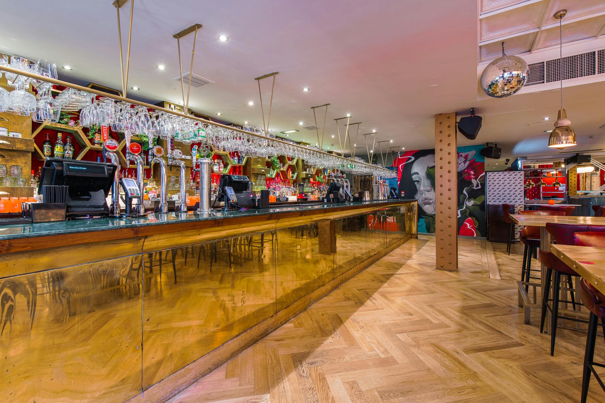 Vibrant bar venue hire in Revolution Parsonage Gardens for events and gatherings.