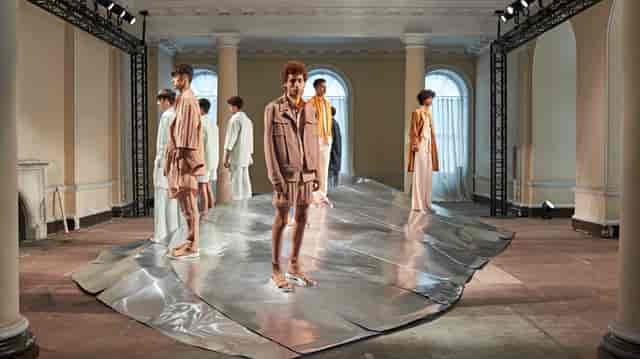 Fashion presentation at The Lancaster Rooms with sleek runway and minimalist backdrop.