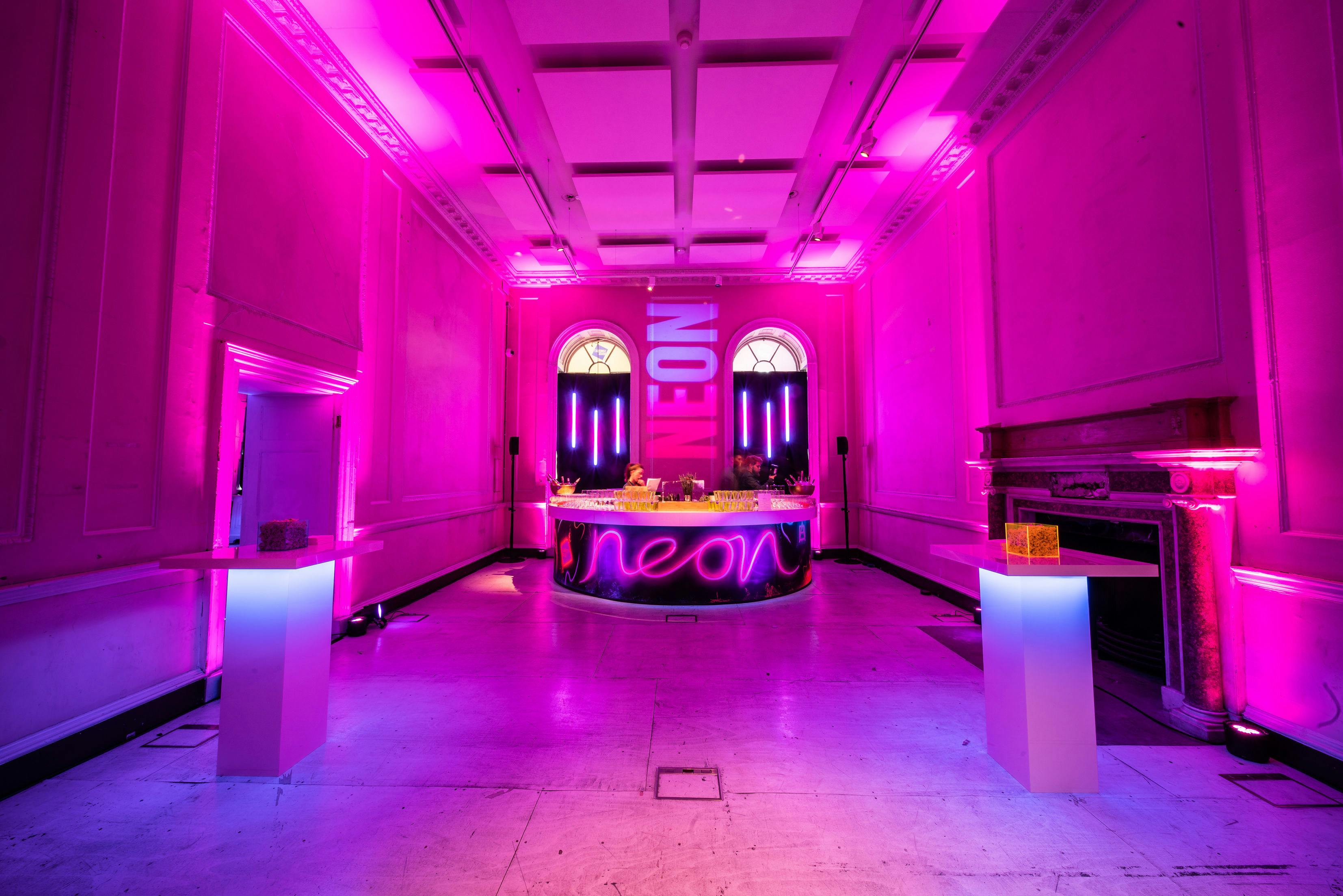 Vibrant River Rooms at Somerset House, pink neon lighting for trendy launch parties.