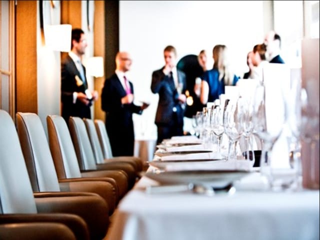 Elegant dining setup at Salon Park Lane for a networking event in a modern venue.