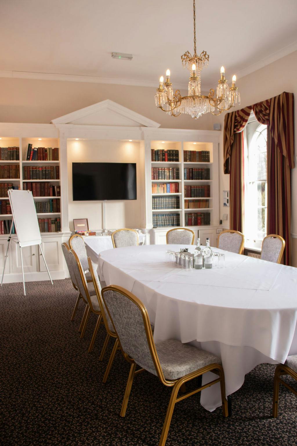 Library Room at Manor of Groves: elegant meeting space for corporate events and gatherings.