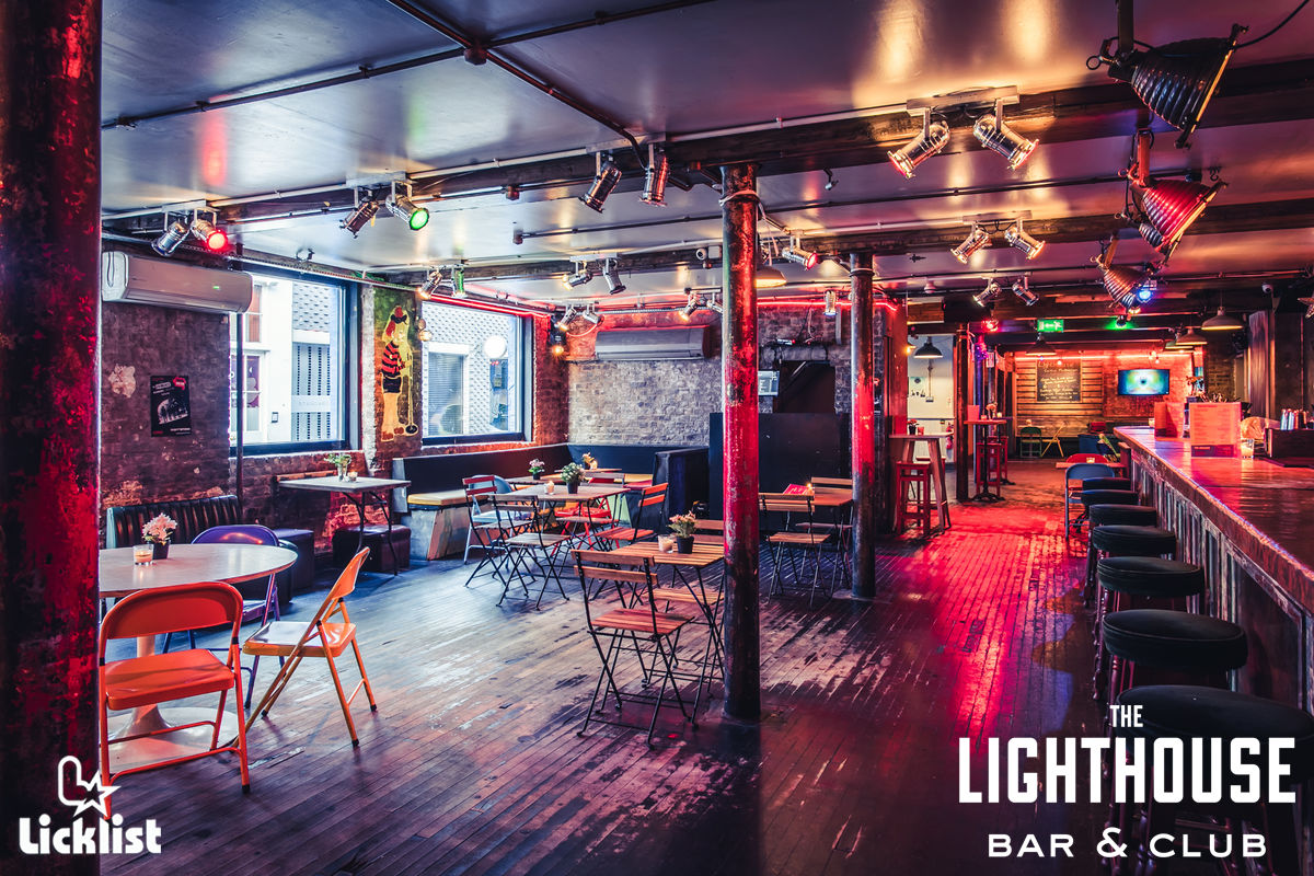 Vibrant event space with exposed brick, ideal for parties and networking events.