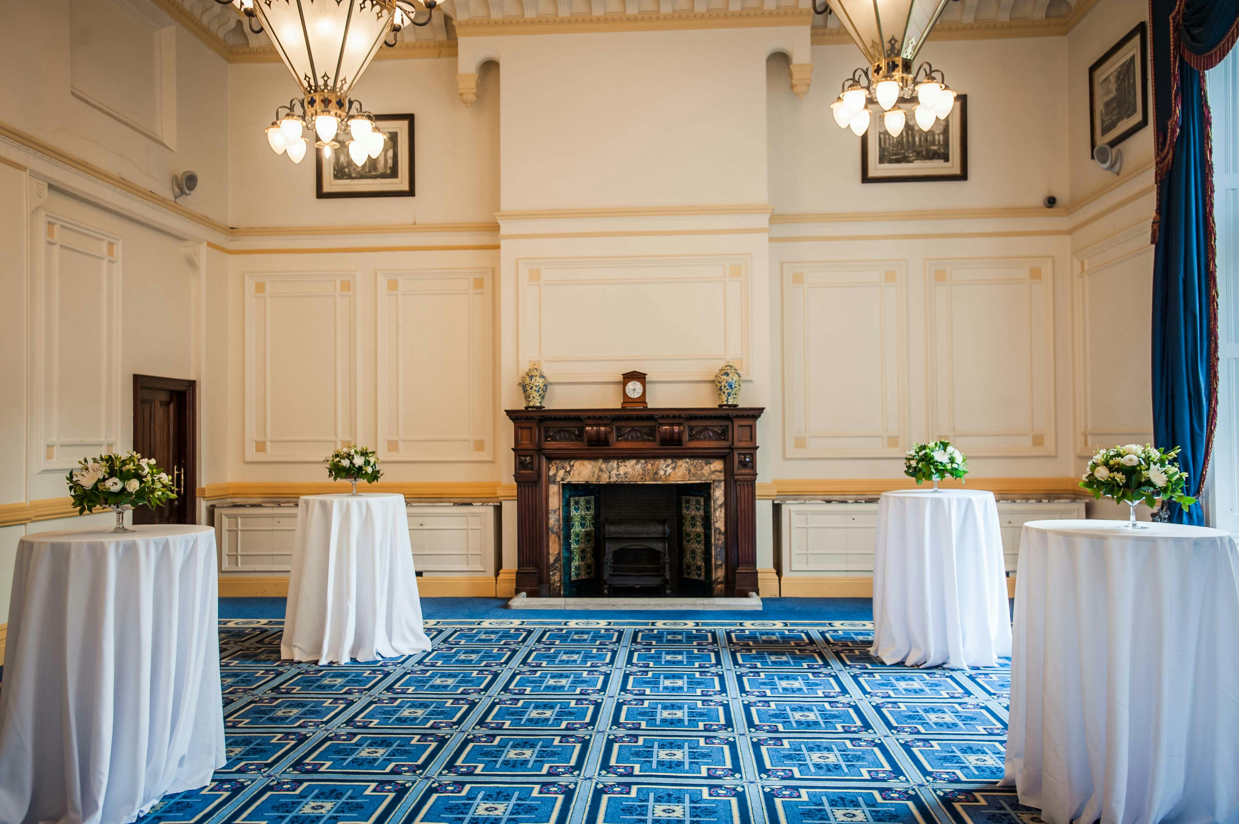 Elegant Meston Suite with floral tables, perfect for networking events and receptions.