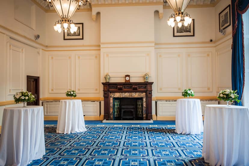 Elegant Meston Suite with floral tables, perfect for networking events and receptions.